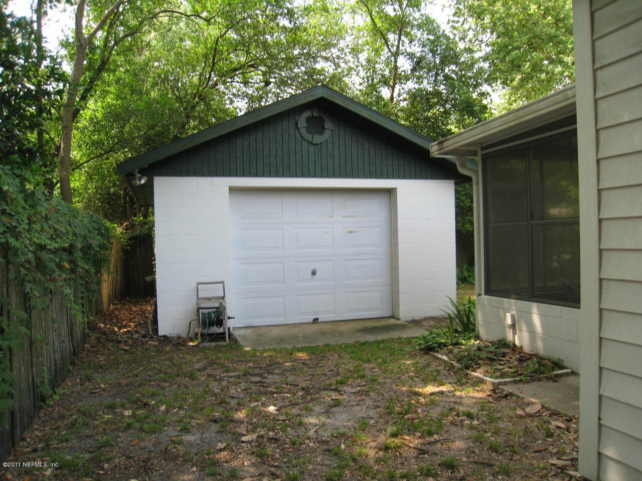 7418 Centauri Road Jacksonville, FL 32210 - Photo 4 of 22 a front view of a house with a yard