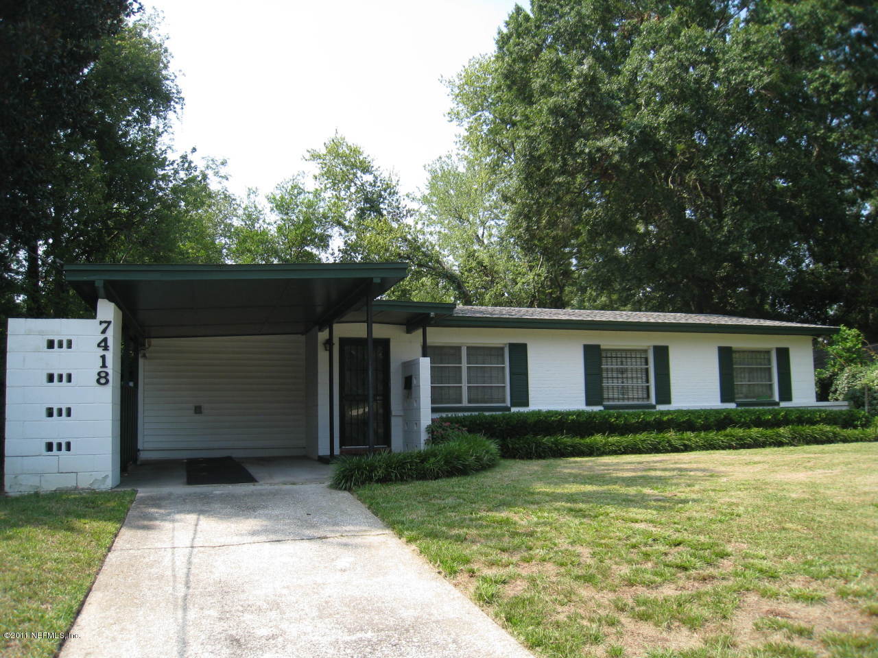 7418 Centauri Road Jacksonville, FL 32210 - Photo 5 of 22 front view of house with a yard