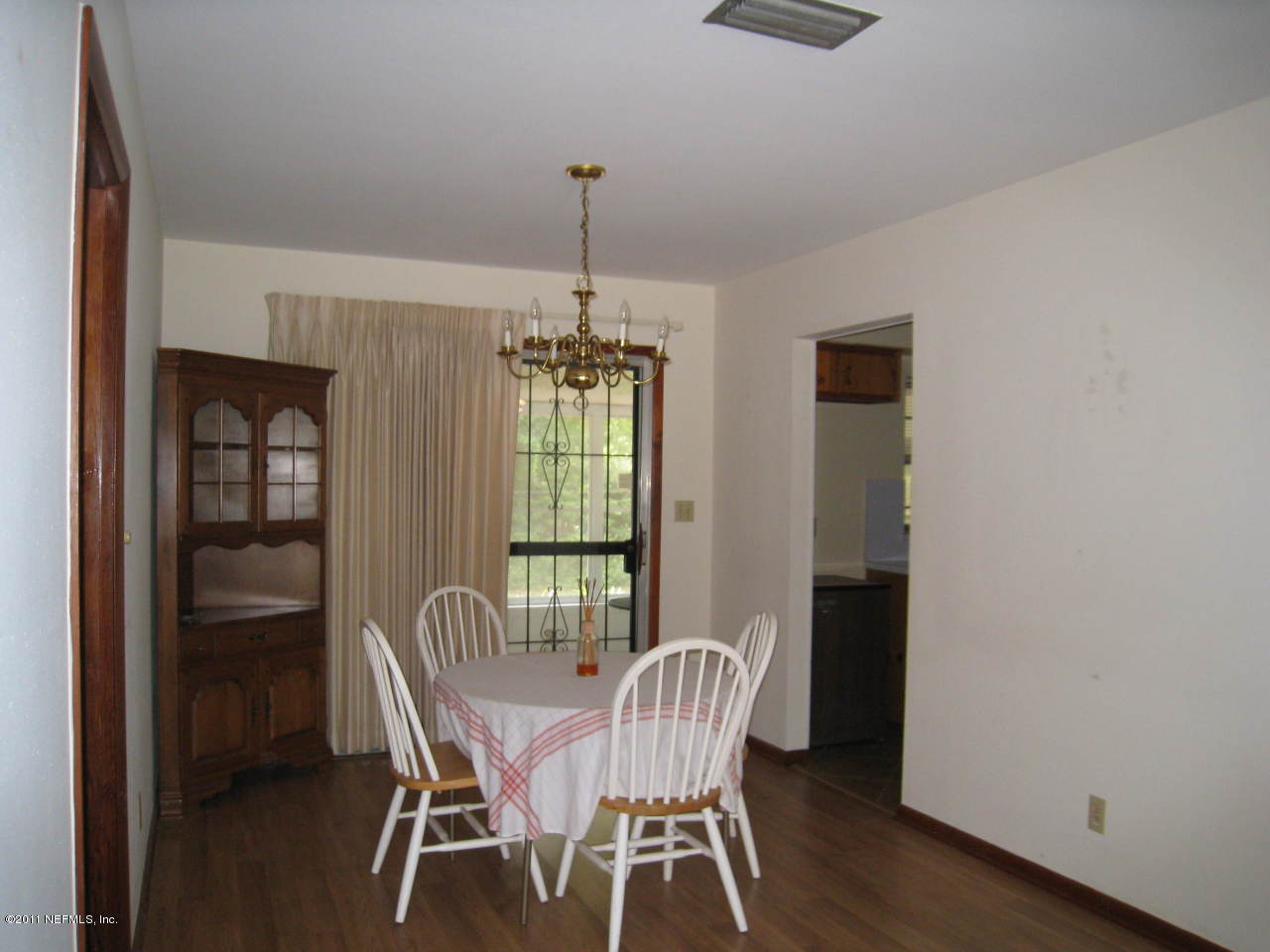 7418 Centauri Road Jacksonville, FL 32210 - Photo 8 of 22 a view of a dining room with furniture window and wooden floor