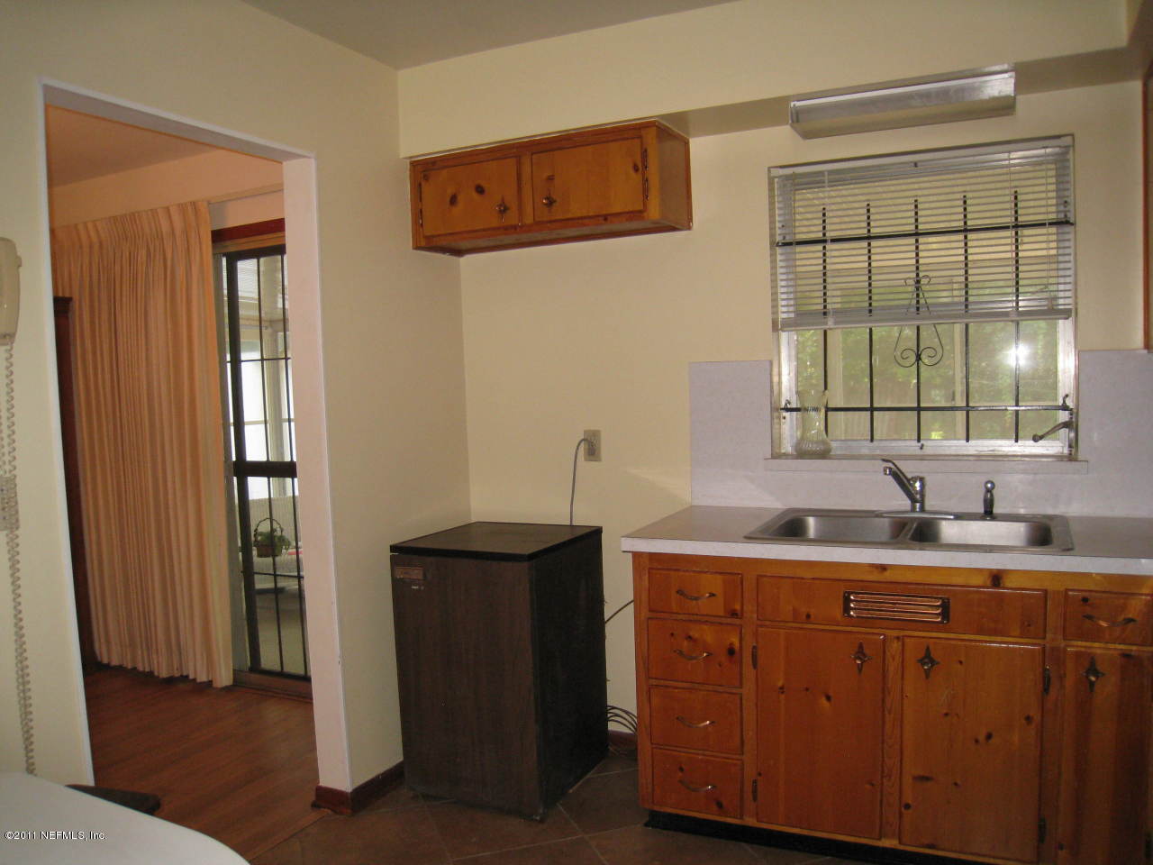 7418 Centauri Road Jacksonville, FL 32210 - Photo 9 of 22 a kitchen with a sink and a window