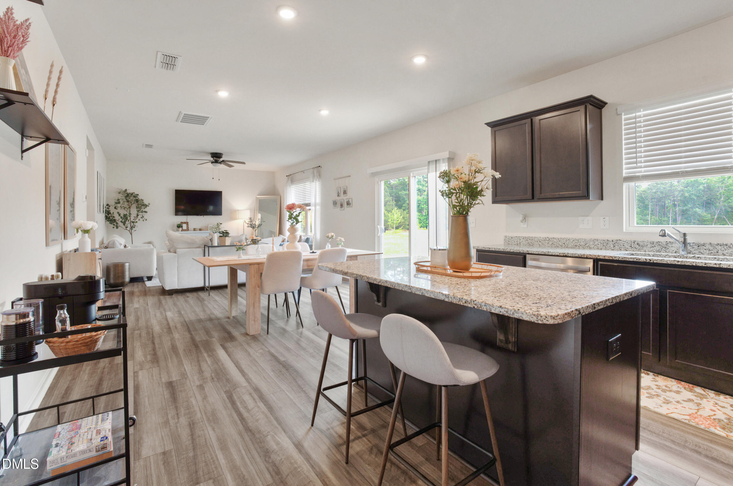 1416 Heron Pond Street Raleigh, NC 27604 - Photo 13 of 25 a open kitchen with granite countertop a table and chairs in it