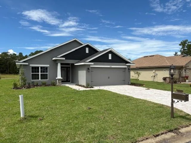 front view of a house with a yard