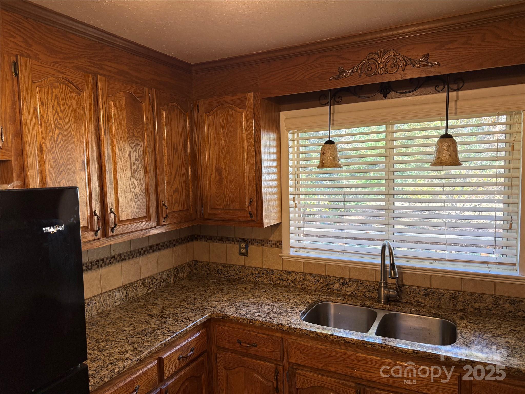 110 Forest Drive Locust, NC 28097 - Photo 13 of 29 a kitchen with a sink and cabinets