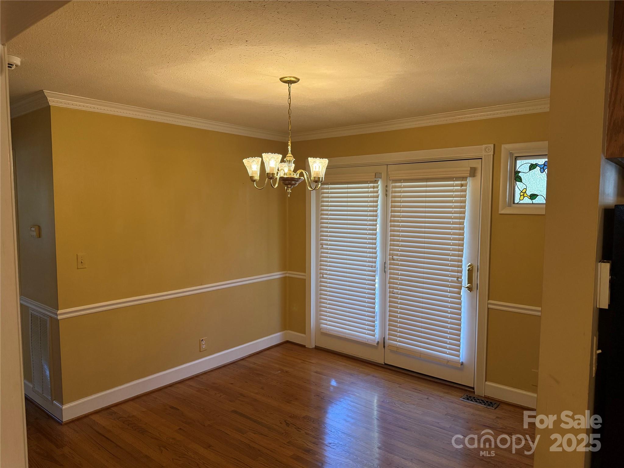 110 Forest Drive Locust, NC 28097 - Photo 14 of 29 an empty room with wooden floor closet and windows