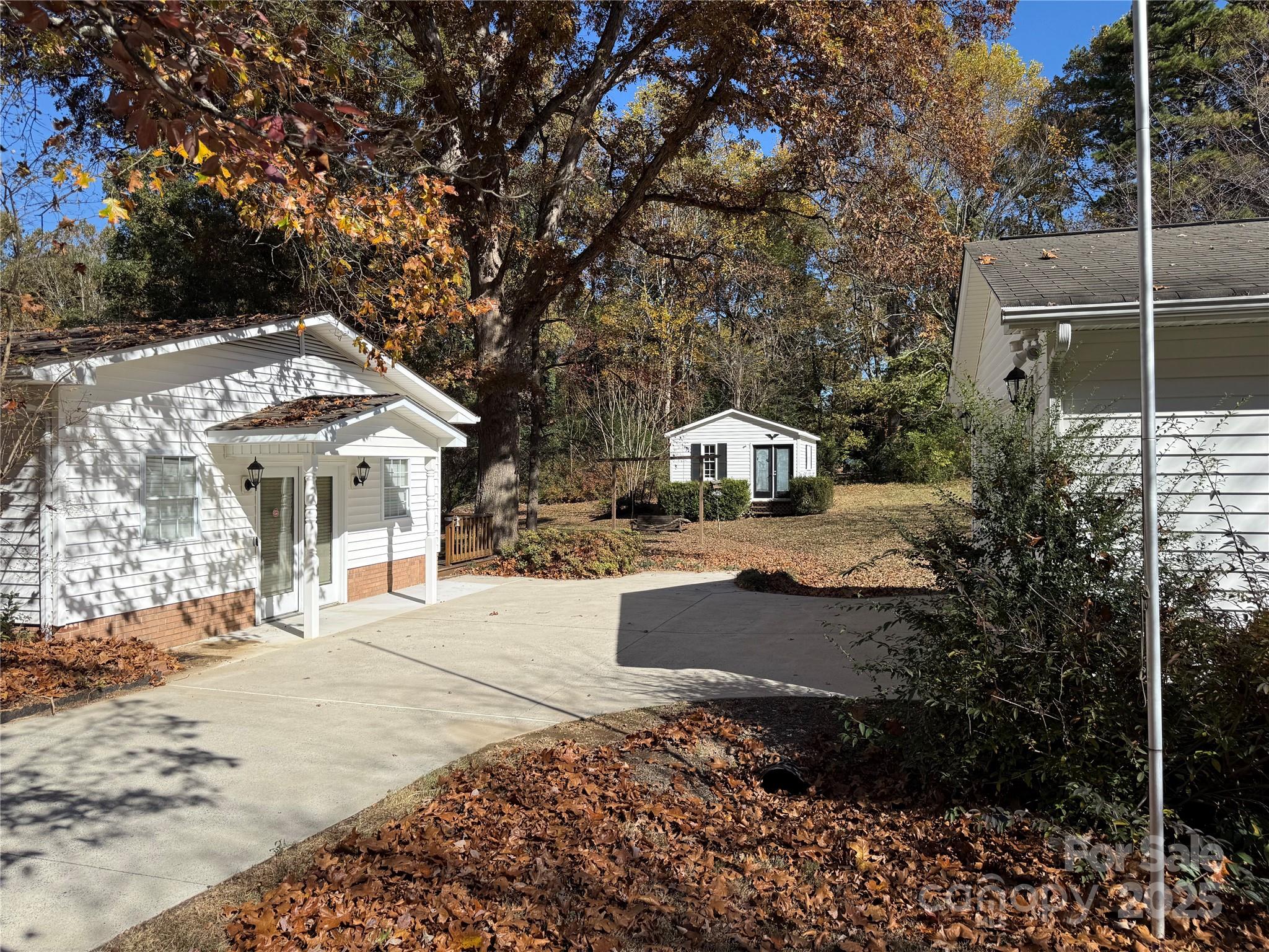 110 Forest Drive Locust, NC 28097 - Photo 3 of 29 a view of a house with a yard