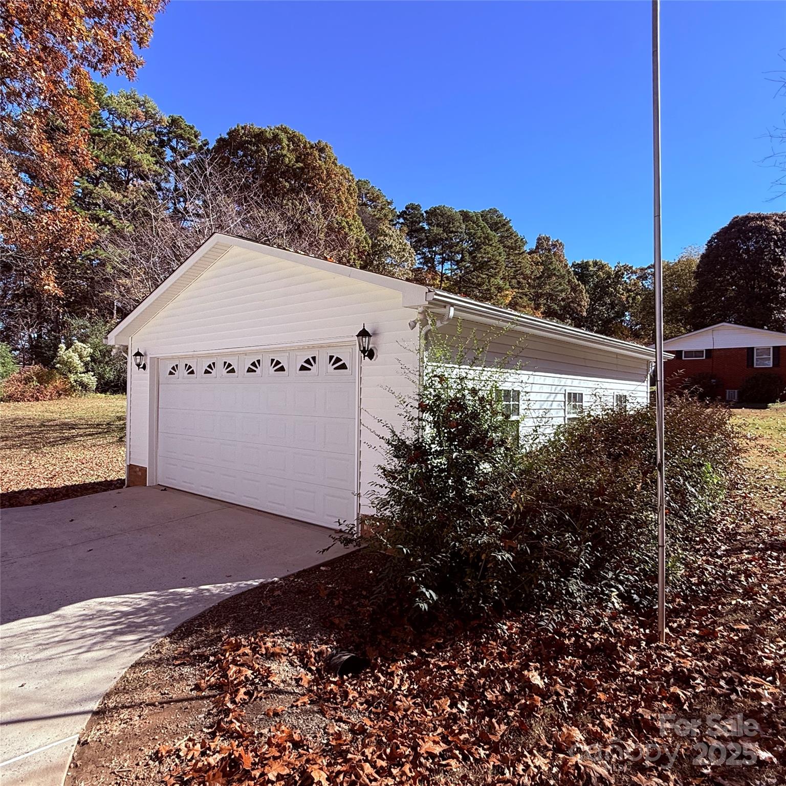 110 Forest Drive Locust, NC 28097 - Photo 4 of 29 a view of a house with a yard and a large tree