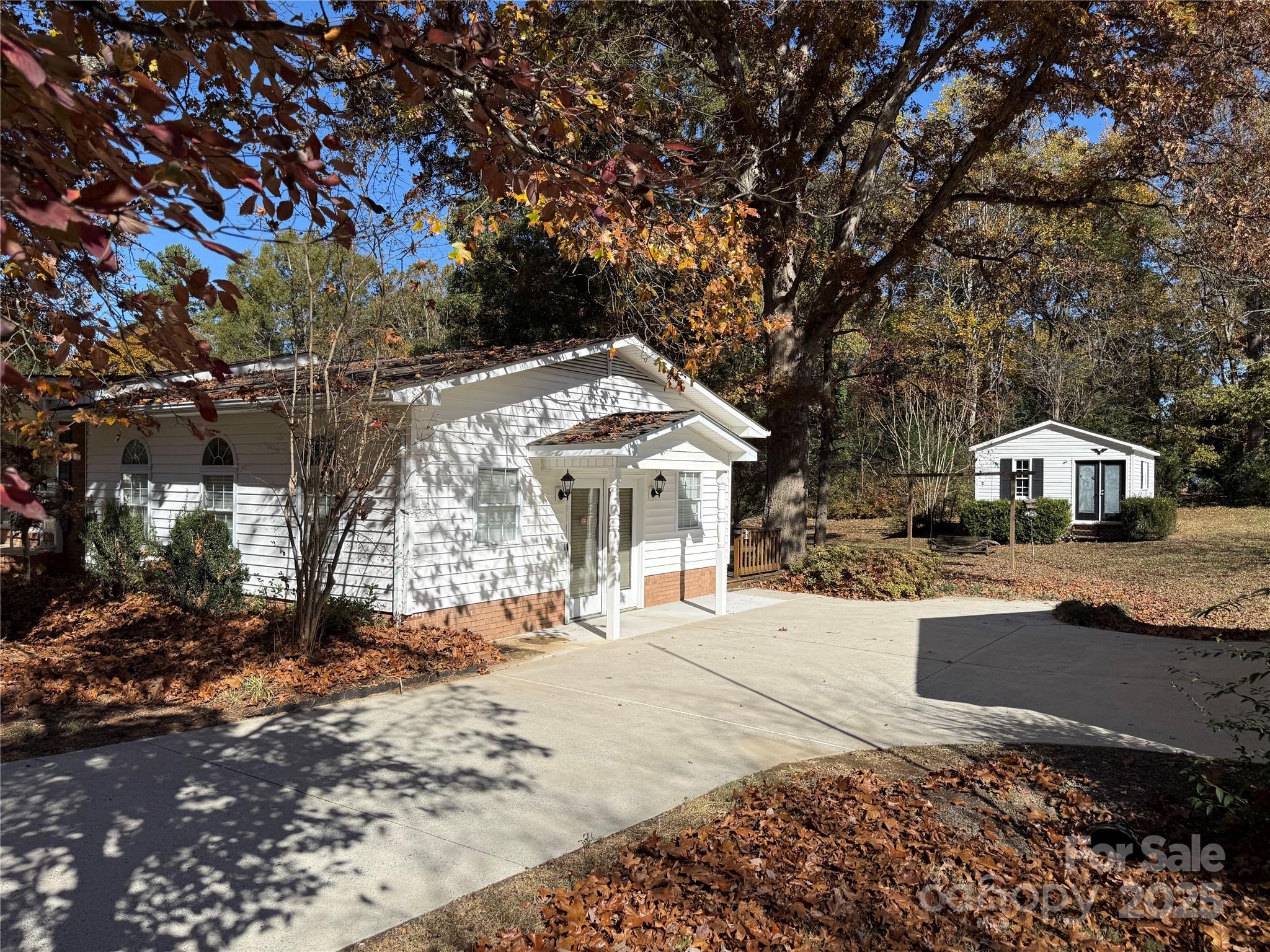 110 Forest Drive Locust, NC 28097 - Photo 6 of 29 a front view of a house with a yard