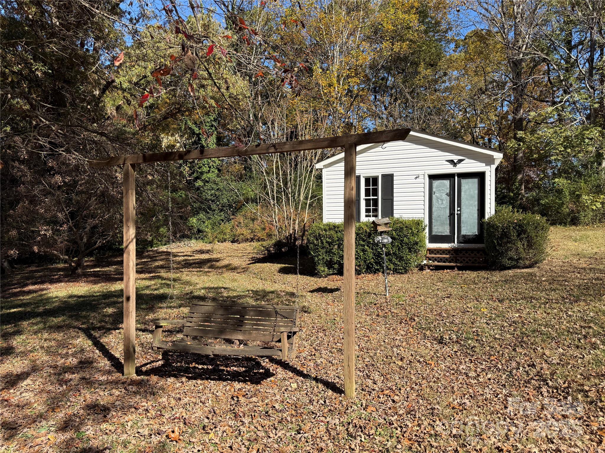 110 Forest Drive Locust, NC 28097 - Photo 7 of 29 a view of a house with a yard