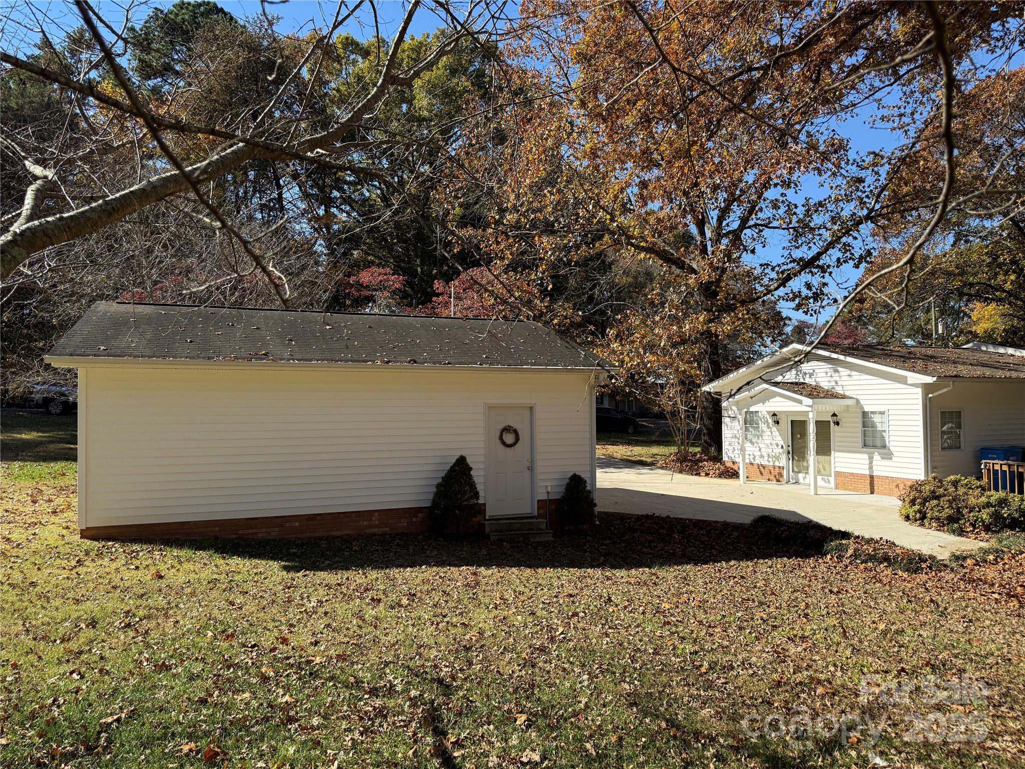 110 Forest Drive Locust, NC 28097 - Photo 8 of 29 a view of a house with a yard
