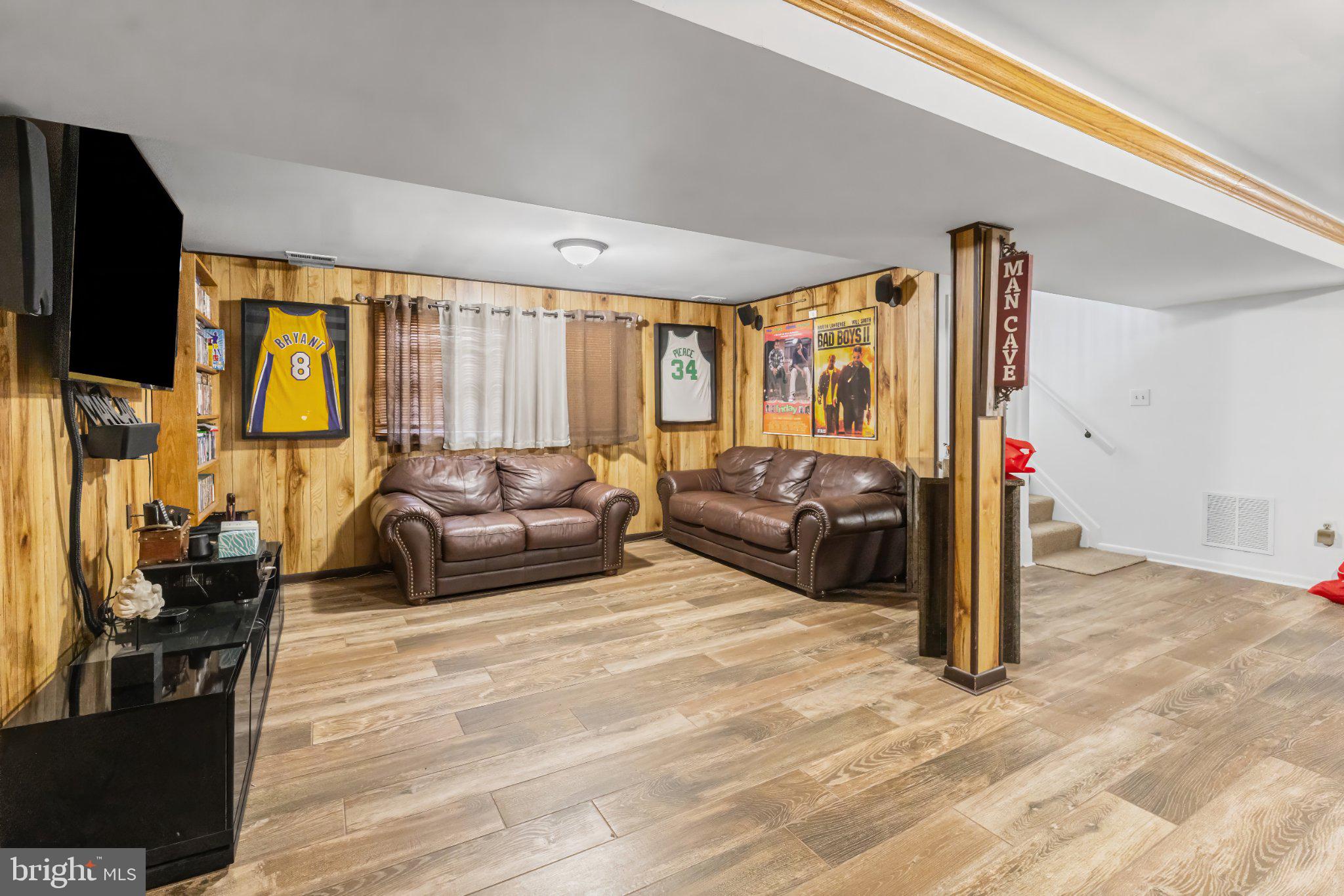 1317 Roxboro Road Baltimore, MD 21237 - Photo 24 of 30 Cozy basement retreat with sports flair.