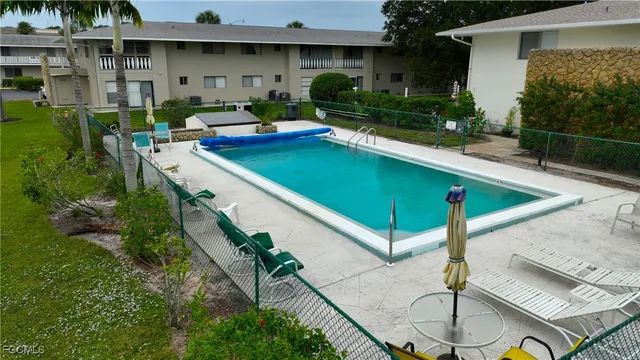 a front view of house with a garden