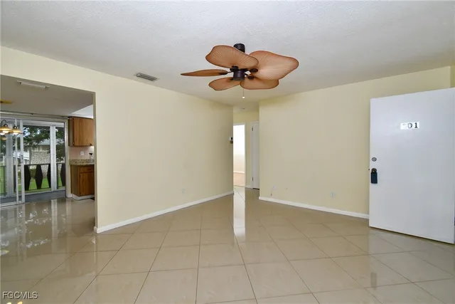 a view of an empty room with a window