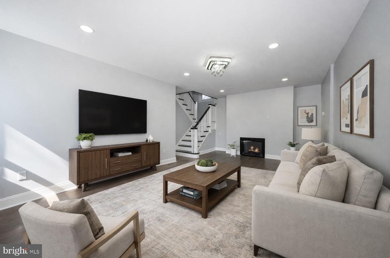 100 Englewood Road Upper Darby, PA 19082 - Photo 1 of 88 a living room with furniture and a flat screen tv