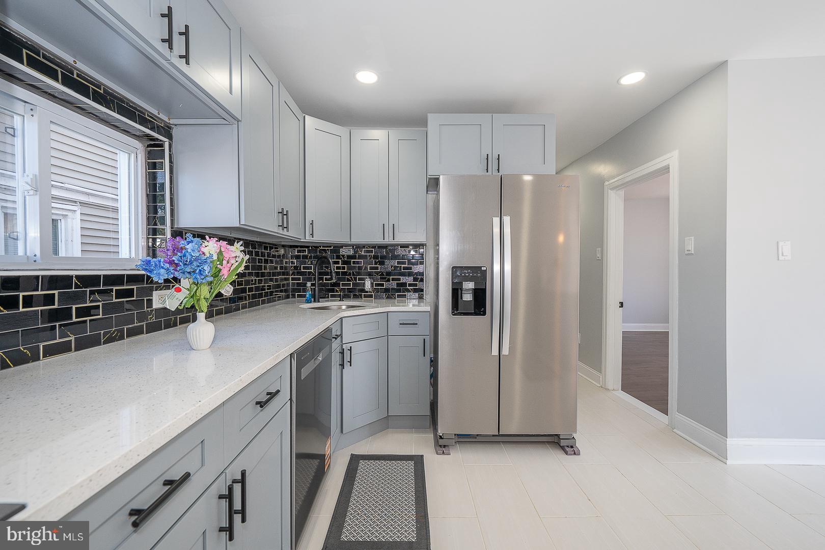 100 Englewood Road Upper Darby, PA 19082 - Photo 31 of 88 a kitchen with stainless steel appliances a refrigerator sink and cabinets