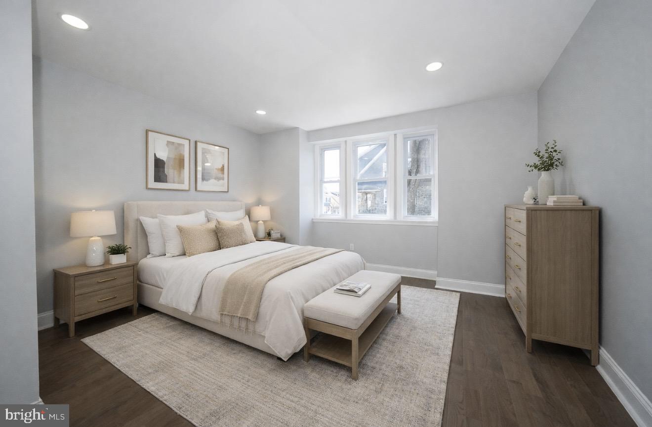 100 Englewood Road Upper Darby, PA 19082 - Photo 4 of 88 a bedroom with a bed and a couch