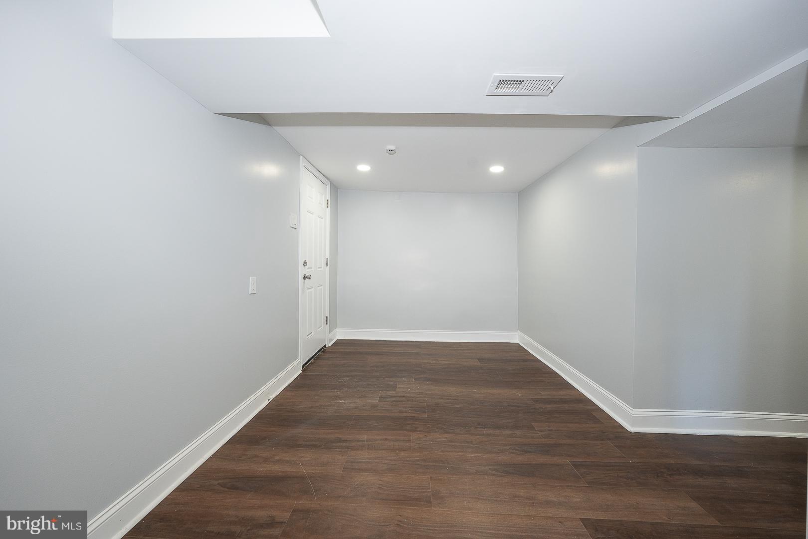 100 Englewood Road Upper Darby, PA 19082 - Photo 56 of 88 a view of an empty room with wooden floor