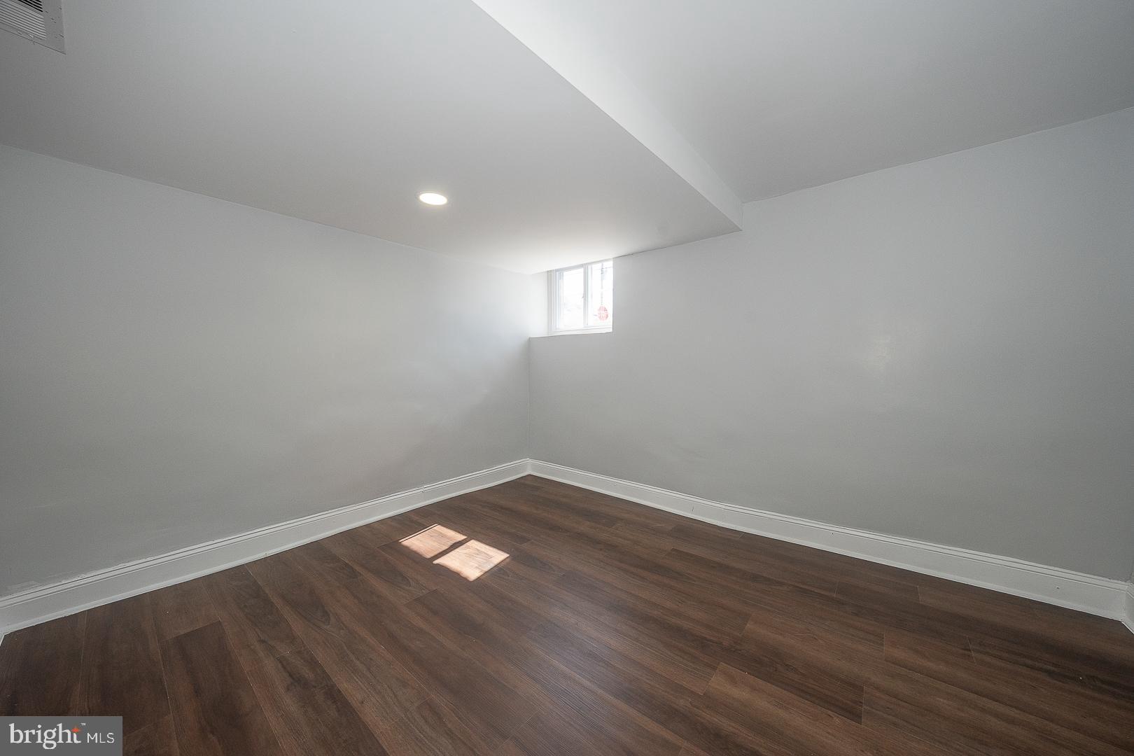 100 Englewood Road Upper Darby, PA 19082 - Photo 59 of 88 a view of empty room with wooden floor and fan