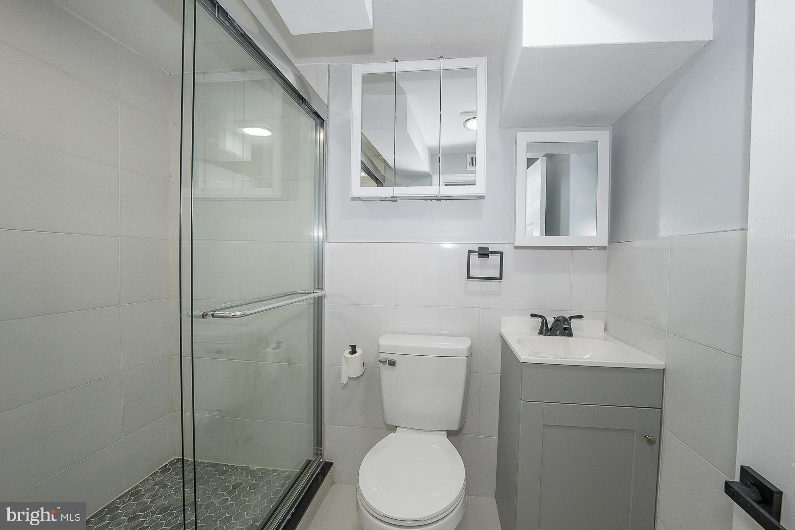 100 Englewood Road Upper Darby, PA 19082 - Photo 66 of 88 a bathroom with a toilet sink vanity and shower