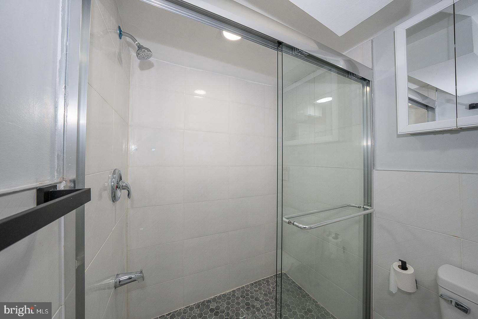 100 Englewood Road Upper Darby, PA 19082 - Photo 67 of 88 a bathroom with a shower and a mirror