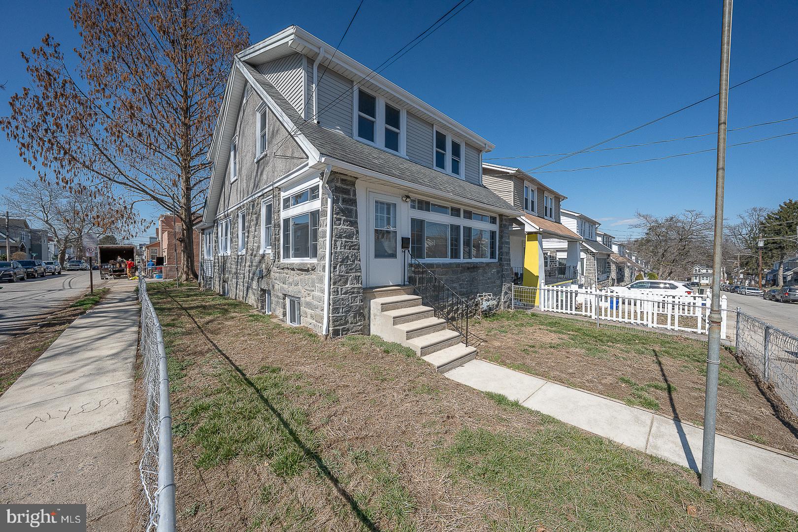 100 Englewood Road Upper Darby, PA 19082 - Photo 82 of 88 a front view of a house with a yard