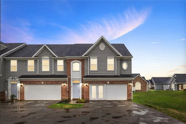 a front view of a house with yard