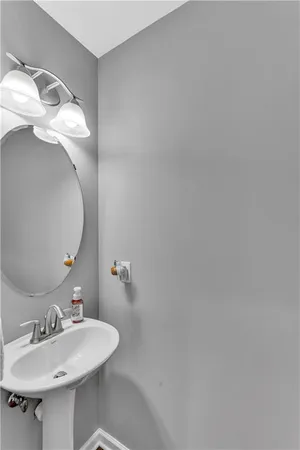 a bathroom with a sink and mirror