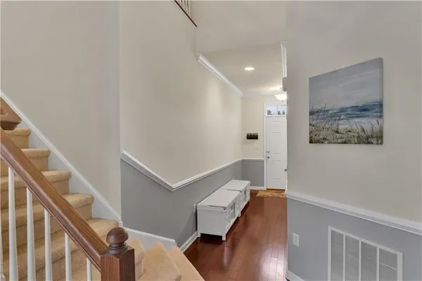 a view of entryway with wooden floor