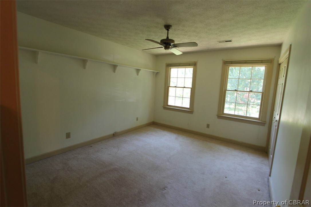 308 Tides Run Yorktown, VA 23692 - Photo 18 of 34 an empty room with a window and a fan