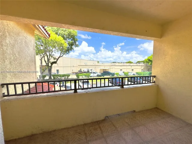 a view of swimming pool from a balcony