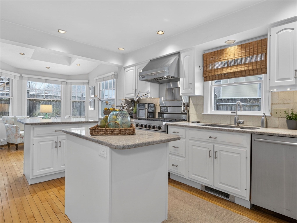 78 Denton Road Wellesley, MA 02482 - Photo 13 of 29 a kitchen with white cabinets and appliances