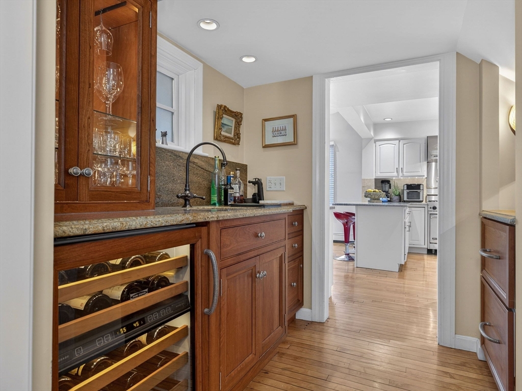 78 Denton Road Wellesley, MA 02482 - Photo 16 of 29 a kitchen with kitchen island a counter top space a sink stainless steel appliances and cabinets