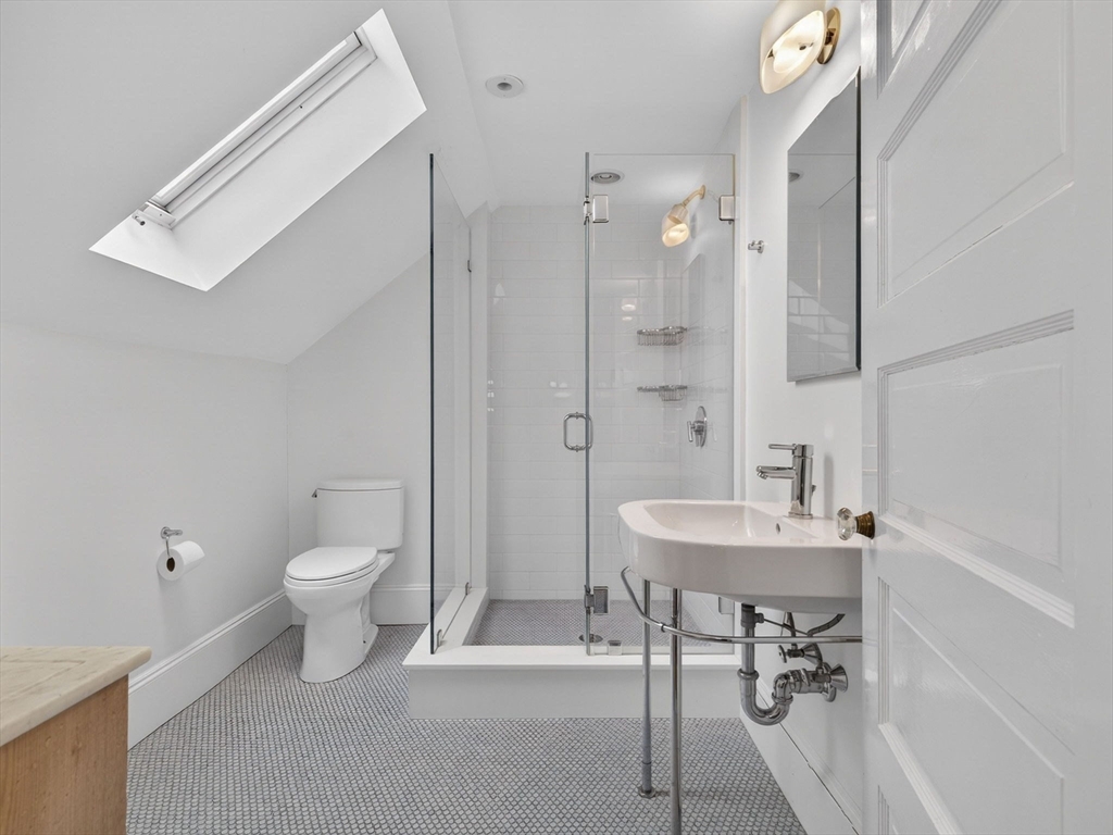 78 Denton Road Wellesley, MA 02482 - Photo 24 of 29 a bathroom with a sink toilet a mirror and shower