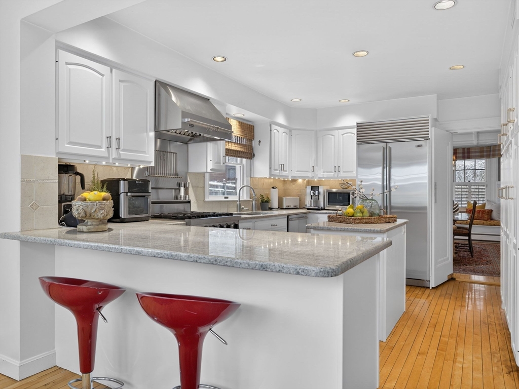 78 Denton Road Wellesley, MA 02482 - Photo 10 of 29 a kitchen with stainless steel appliances granite countertop a sink a stove and a wooden floors