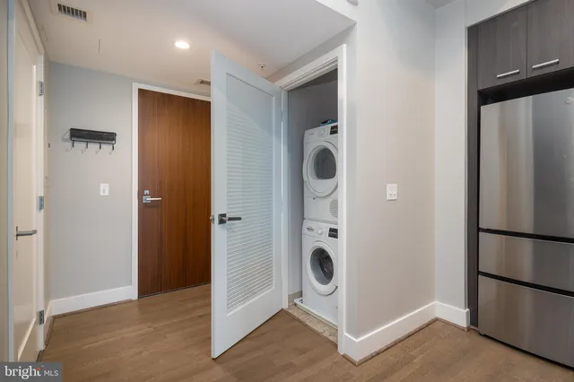 a bedroom with a bed and glass windows