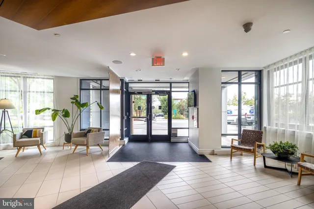 a view of a brick building next to a yard