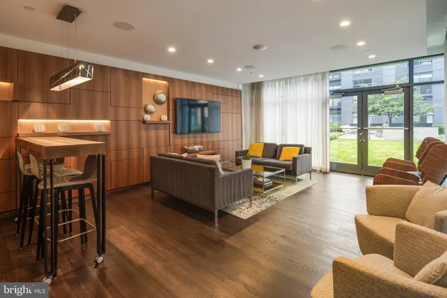 a view of a lake with boats and trees in the background