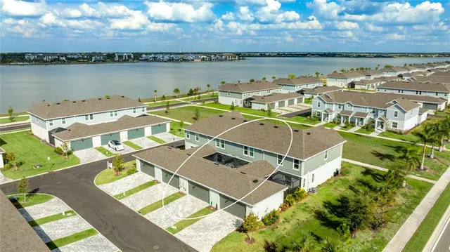 an aerial view of a house with outdoor space