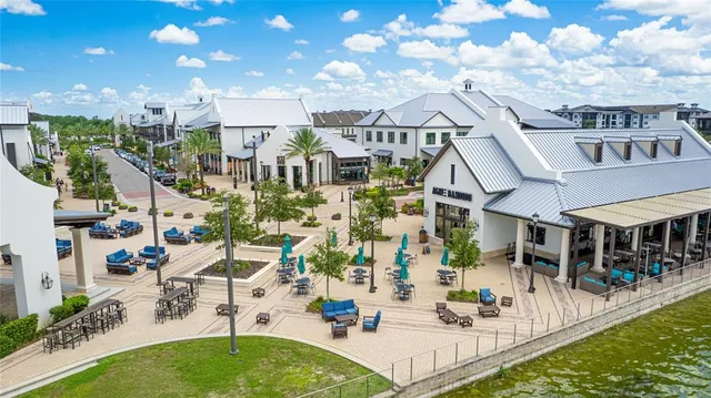 a view of a swimming pool with a table and chairs