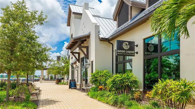a view of a swimming pool with an outdoor seating