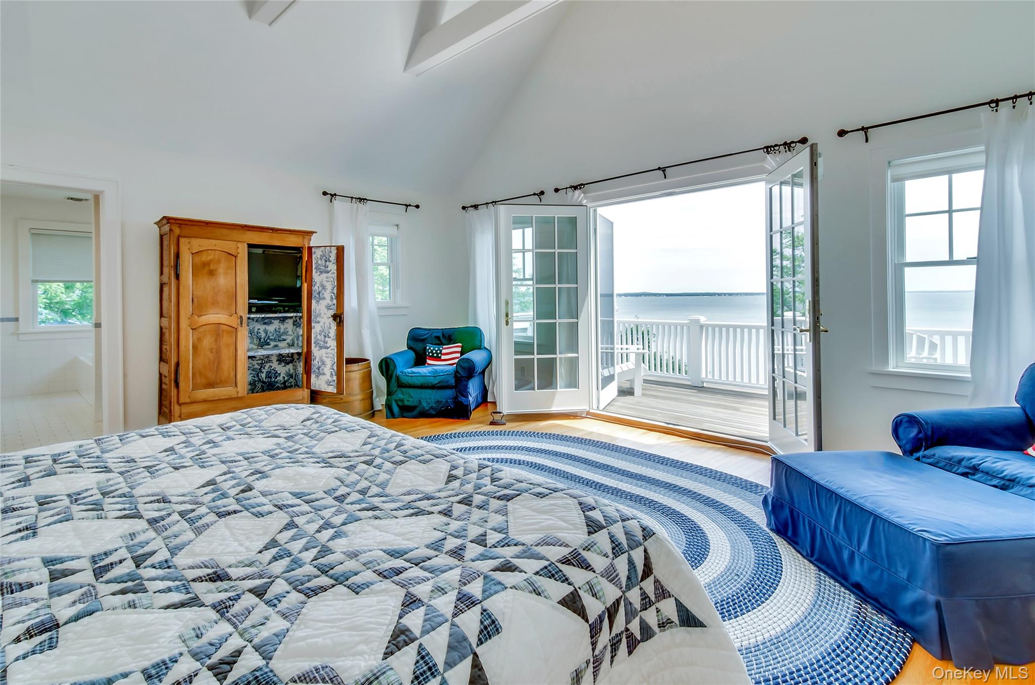 4705 Nassau Point Road Cutchogue, NY 11935 - Photo 11 of 26 a bedroom with a bed and wooden floor