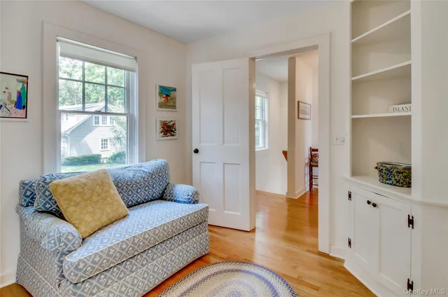 a living room with furniture and a rug
