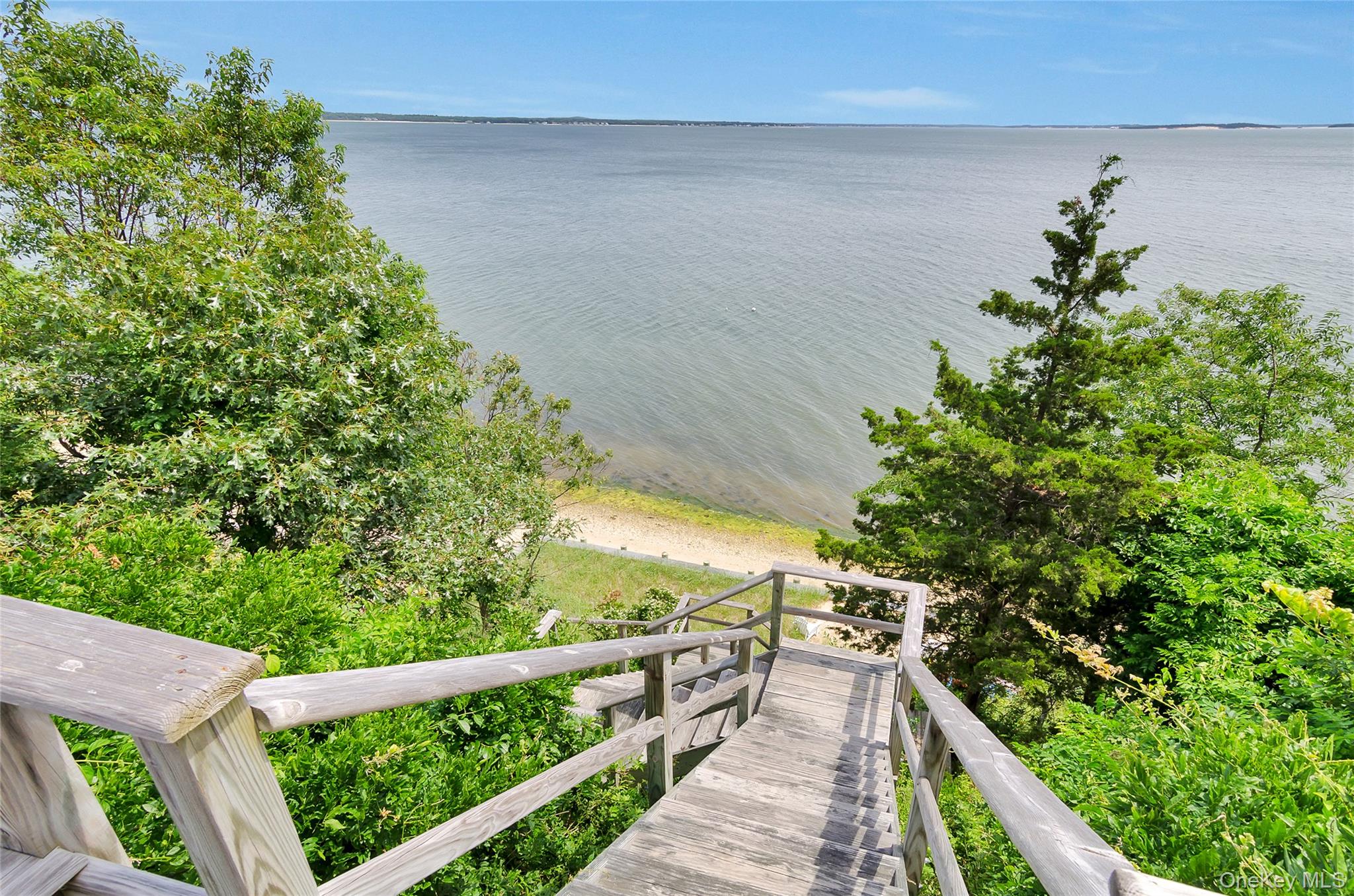 4705 Nassau Point Road Cutchogue, NY 11935 - Photo 22 of 26 a view of balcony with wooden floor and outdoor space