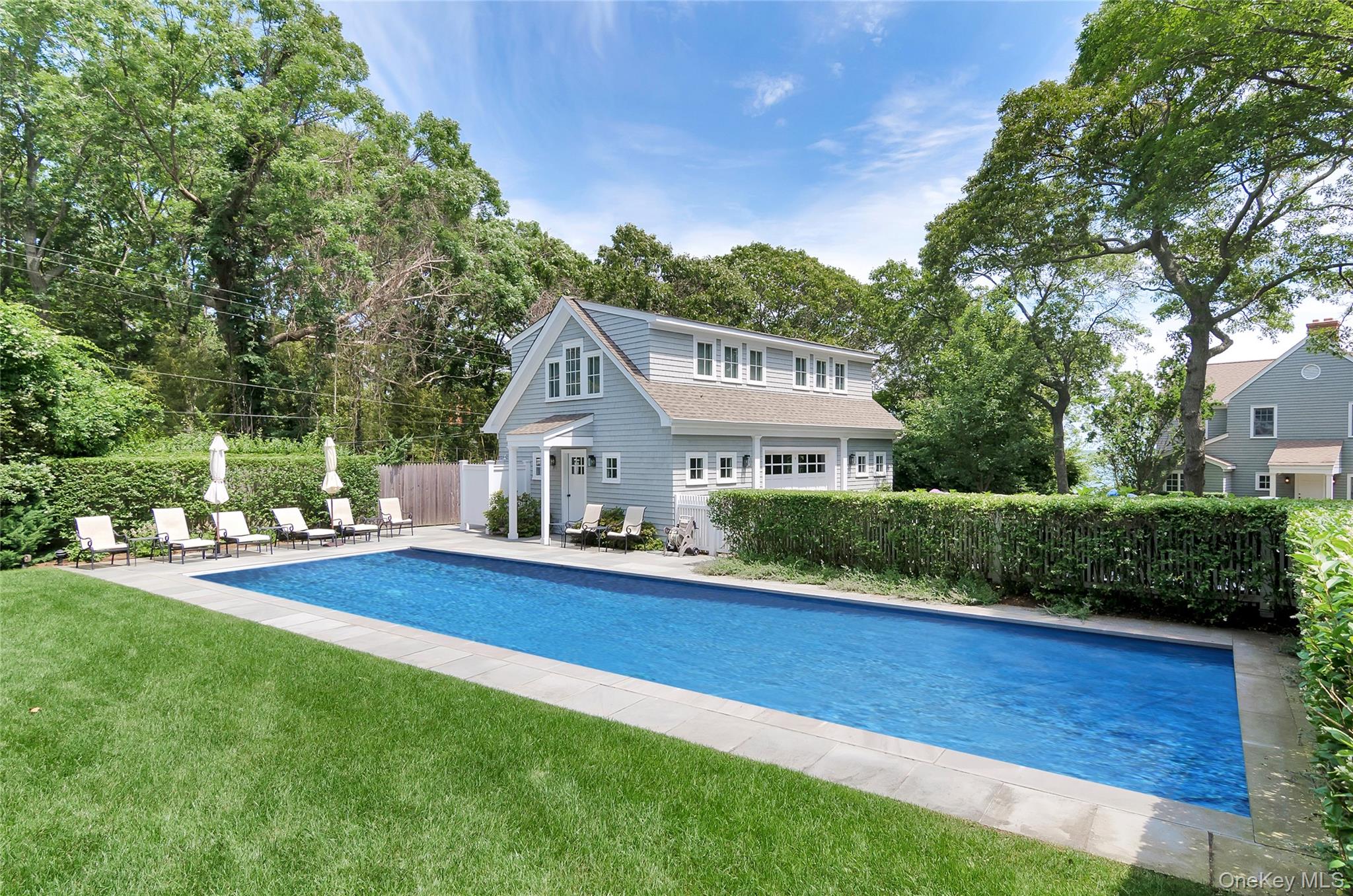 4705 Nassau Point Road Cutchogue, NY 11935 - Photo 24 of 26 a front view of a house with a yard