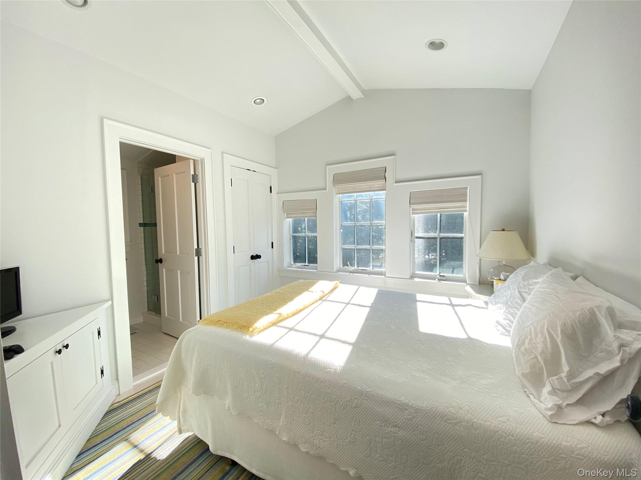 4705 Nassau Point Road Cutchogue, NY 11935 - Photo 26 of 26 a bedroom with a bed and a large window