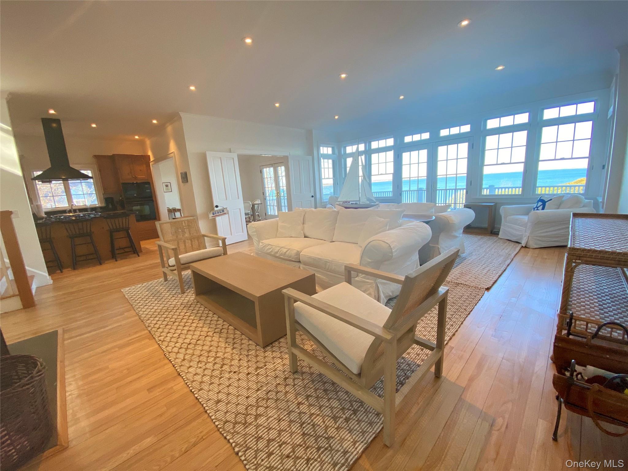 4705 Nassau Point Road Cutchogue, NY 11935 - Photo 3 of 26 a living room with furniture and a rug