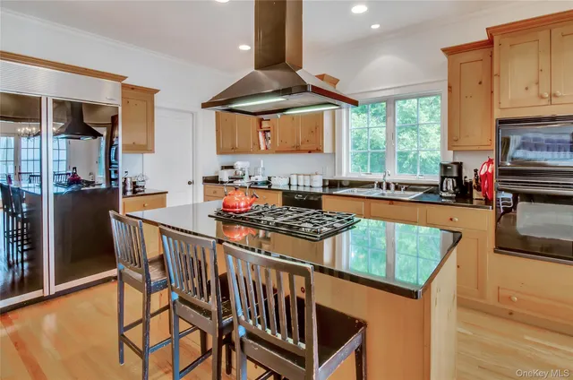 a kitchen with stainless steel appliances granite countertop a stove a sink dishwasher and cabinets