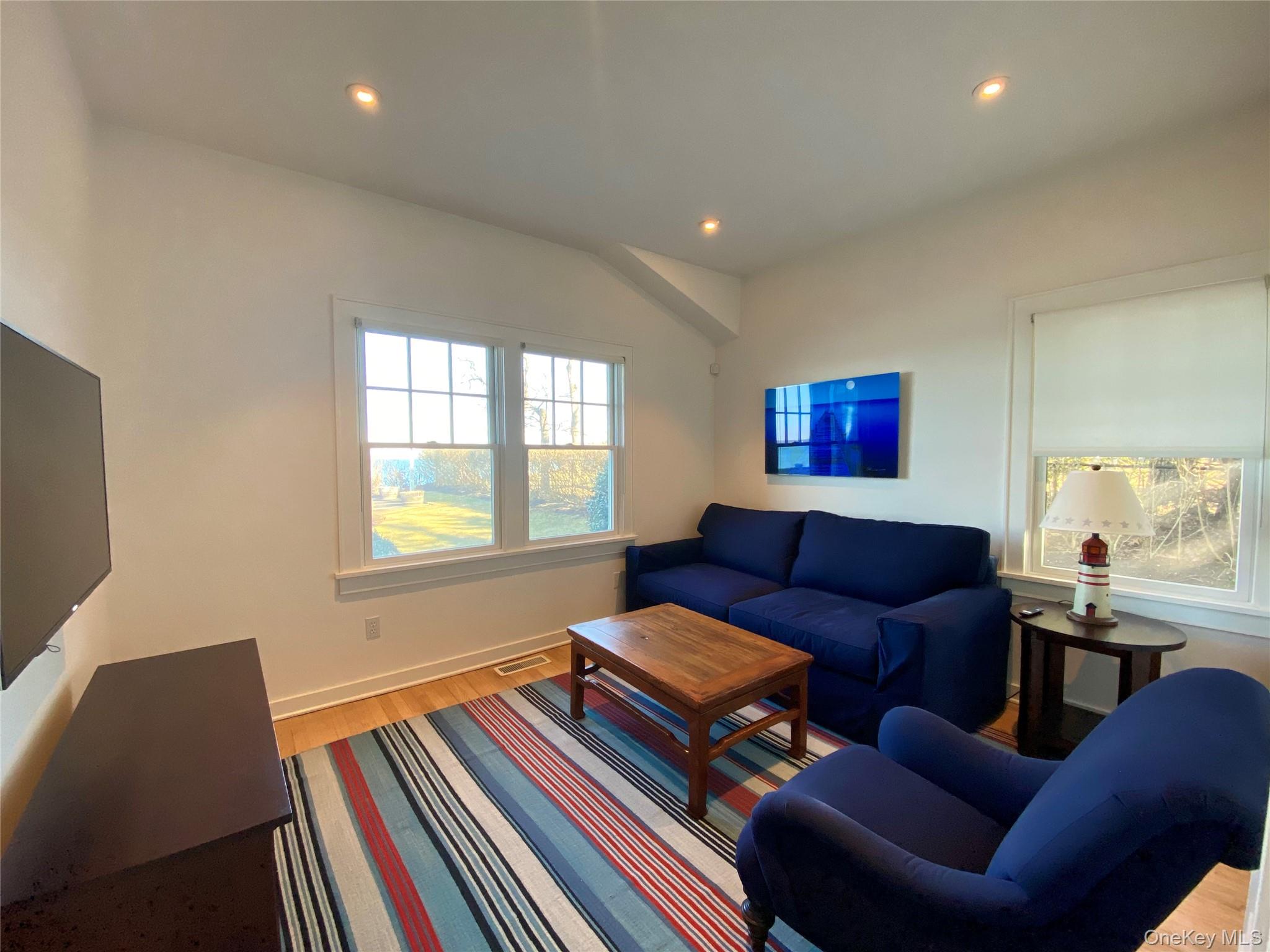 4705 Nassau Point Road Cutchogue, NY 11935 - Photo 10 of 26 a living room with furniture and a window
