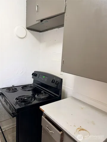 a close up of a stove top oven sitting inside of a kitchen