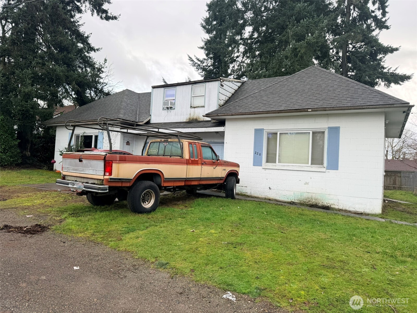 224 116th Street South Tacoma, WA 98444 - Photo 2 of 26 a car parked in front of a house with a yard