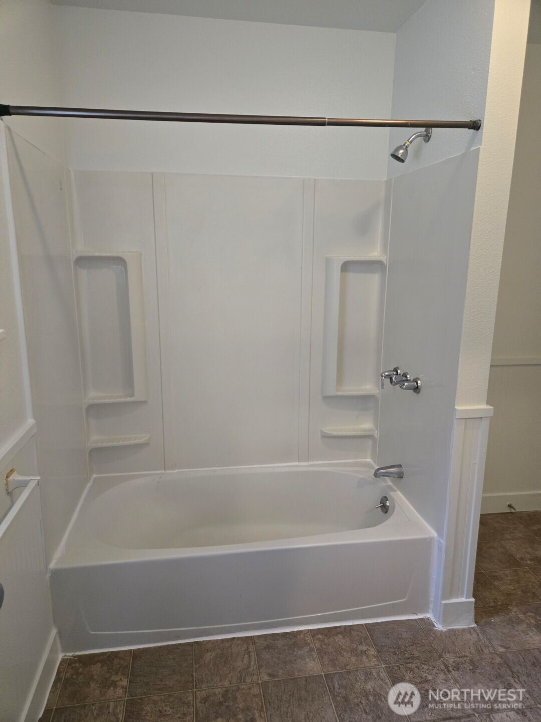 224 116th Street South Tacoma, WA 98444 - Photo 21 of 26 a bathroom with a bathtub and a shower